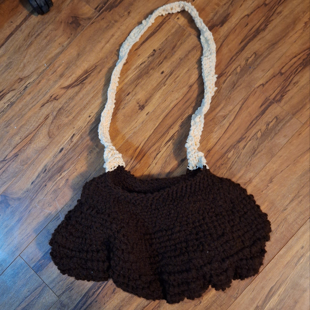 brown clamshell purse